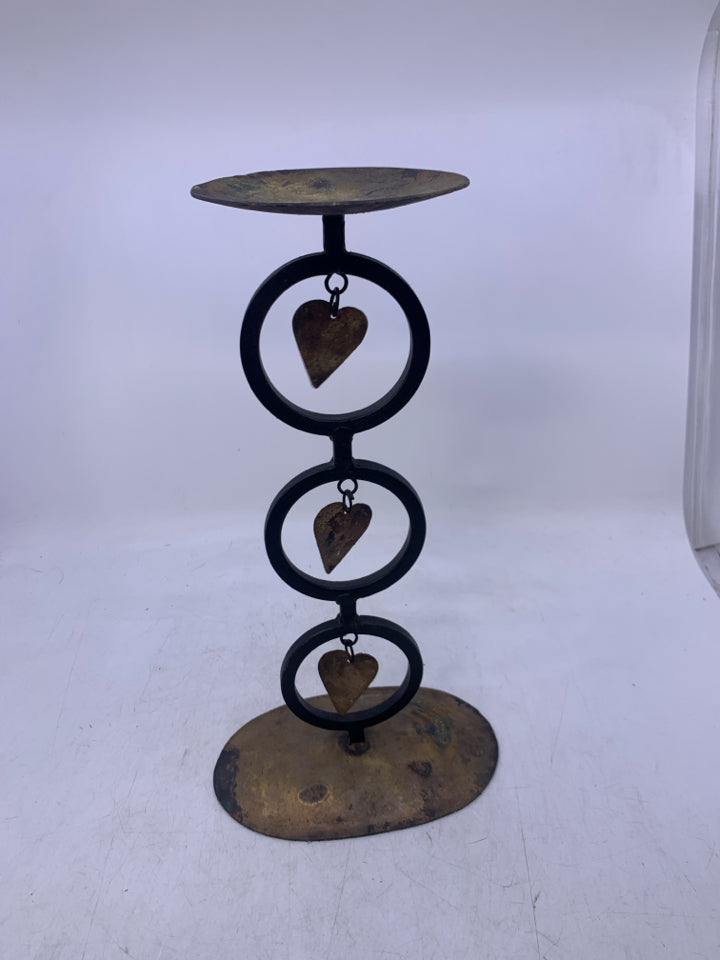 METAL RUSTIC PILLAR CANDLE HOLDER W/ HEARTS/CIRCLES.