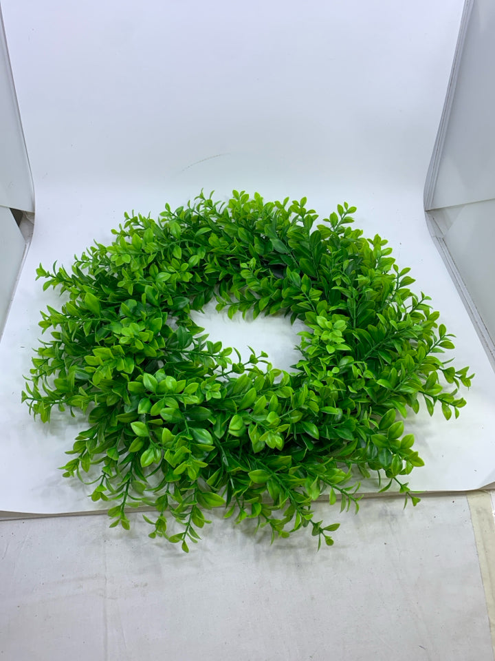 PLASTIC GREENS WREATH.