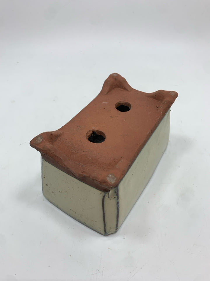 TAN GLAZED TERRACOTTA PLANTER.
