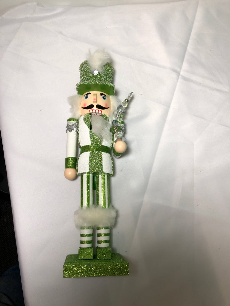 GREEN AND WHITE GLITTER NUT CRACKER.