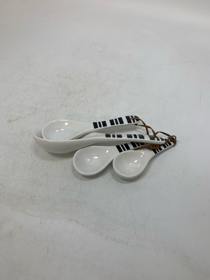 4 CERAMIC MEASURING SPOONS.
