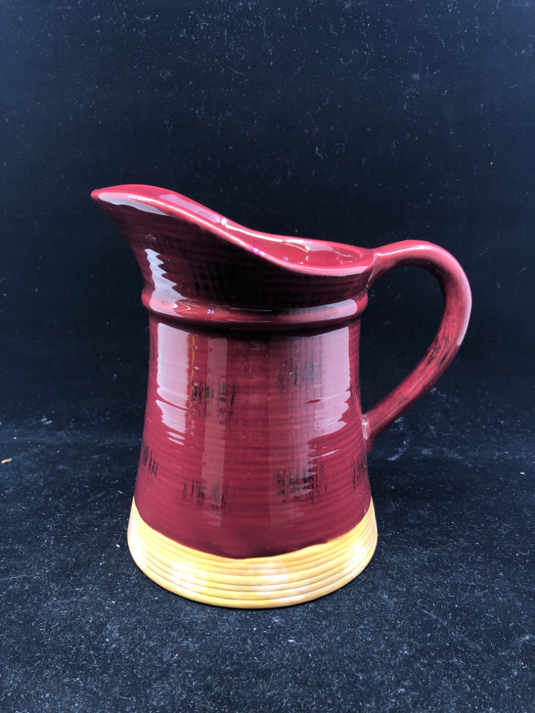 RED PITCHER W PEACH BOTTOM RIM.