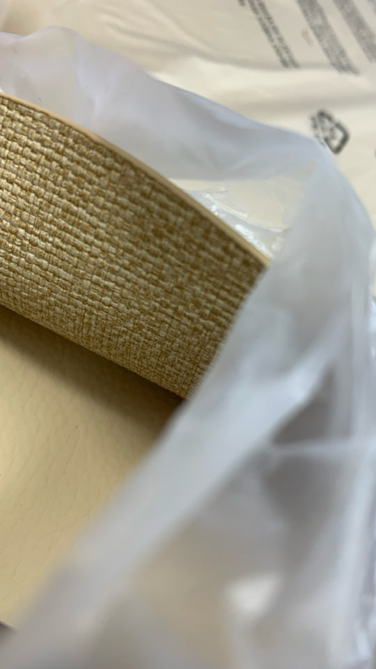 NIP 6PC CREAM COLORED LEATHER-BACKED PLACEMATS.