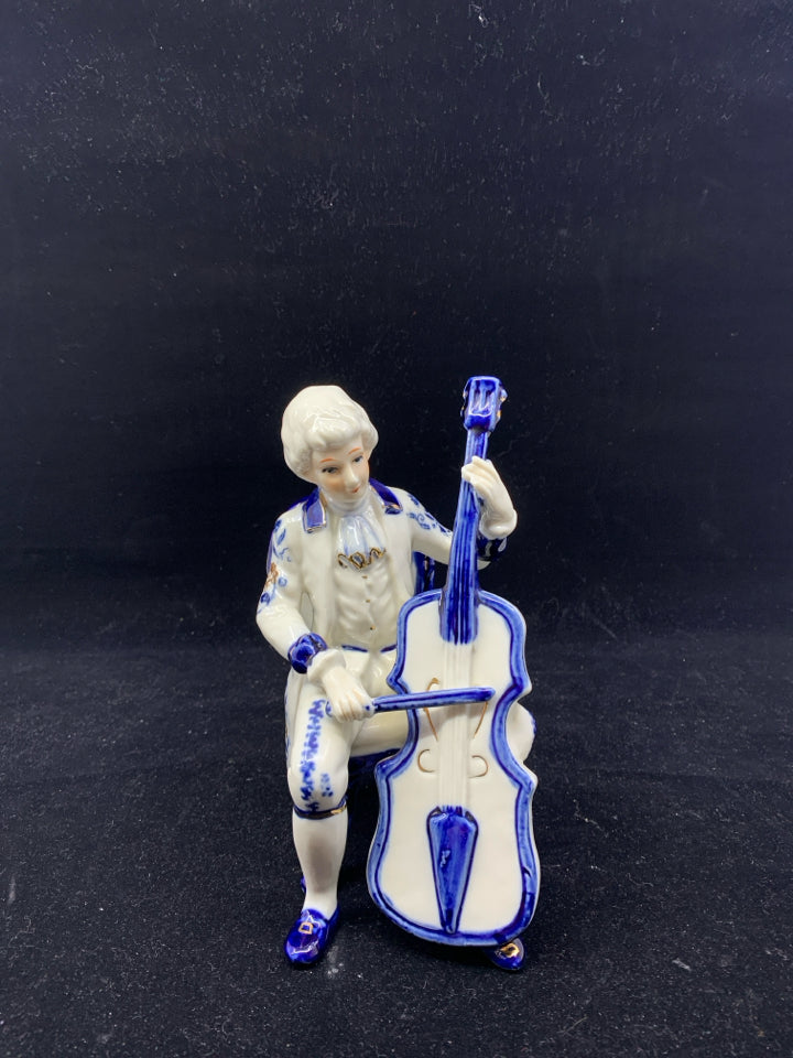 VTG BLUE AND WHITE VICTORIAN MAN PLAYING CELLO.