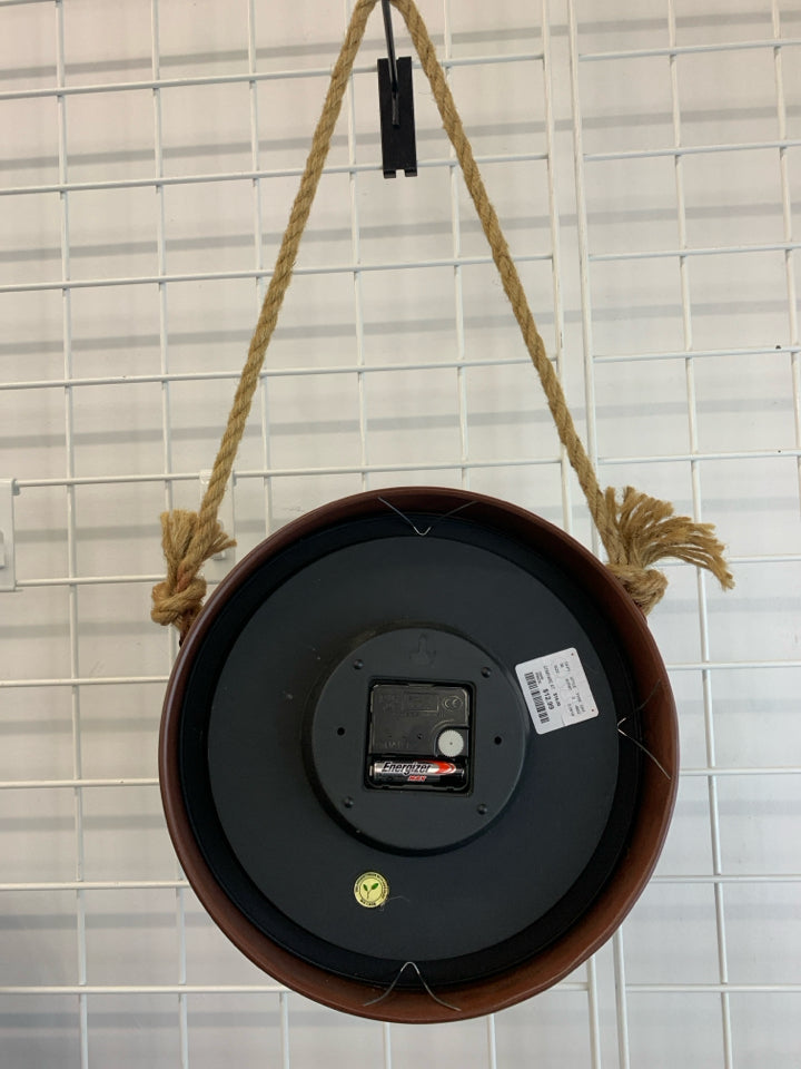 RED METAL INDUSTRIAL HANGING CLOCK.