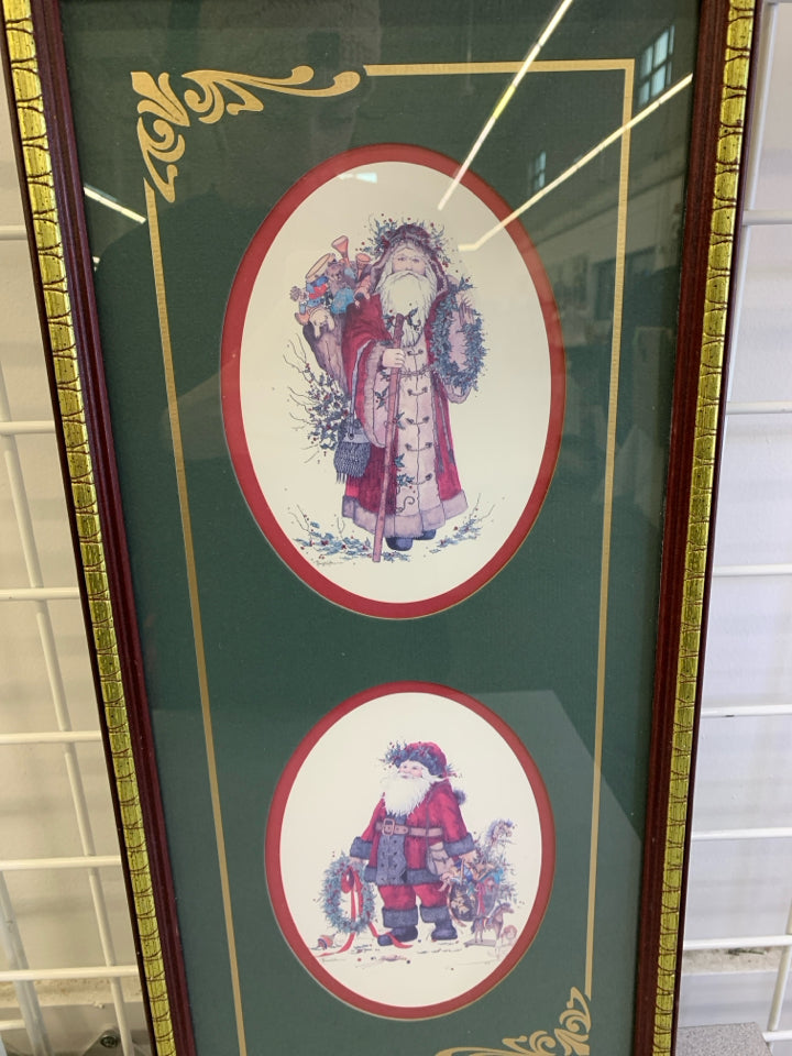 2 SANTAS IN CIRCLES GREEN WALL HANGING W/RED&GOLD FRAME.