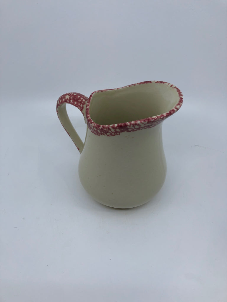SMALL CREAM PITCHER W RED SPONGED RIM AND HANDLE.