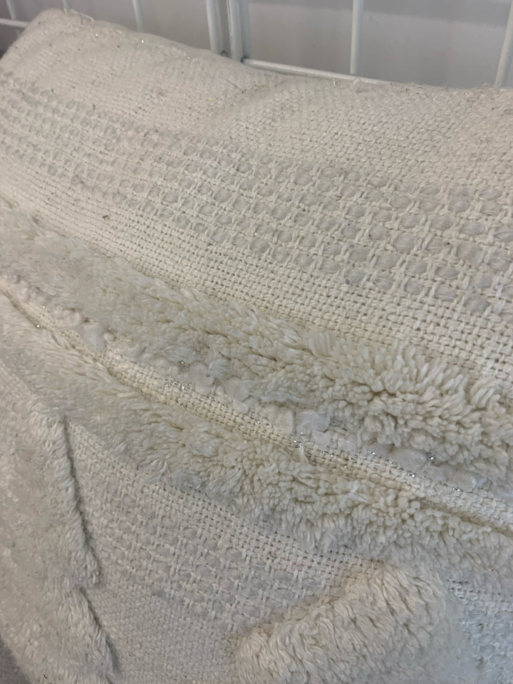 WHITE FABRIC PILLOW W/PINE TREE AND TASSELS.