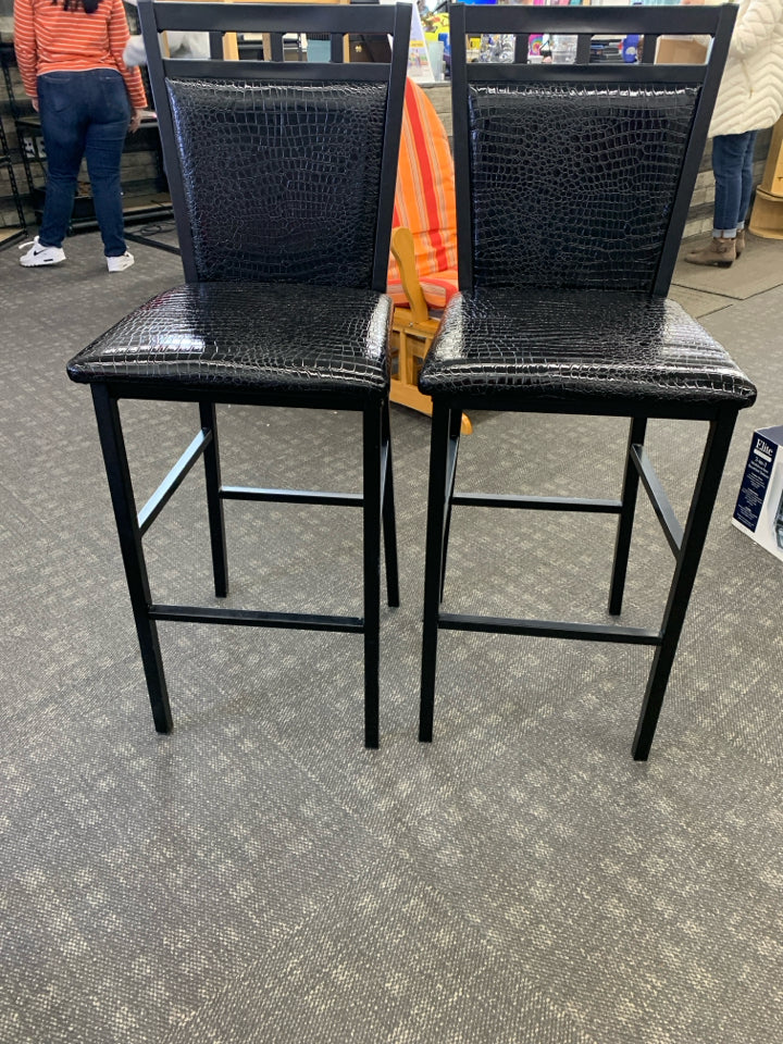 2 METAL AND FAUX LEATHER BAR STOOLS.