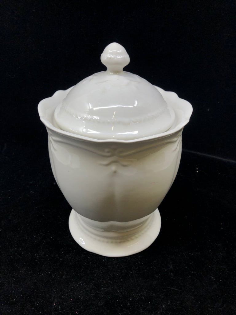 WHITE EMBOSSED FOOTED CANISTER W LID.