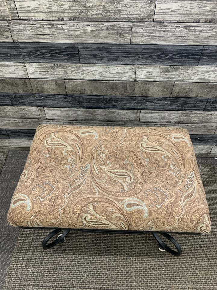 BROWN PAISLEY AND BLACK SCROLL BASE FOOTSTOOL.