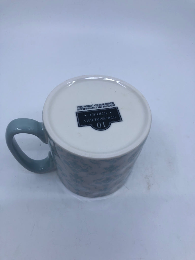 LIGHT BLUE SCROLL/FLORAL DESIGN MUG.