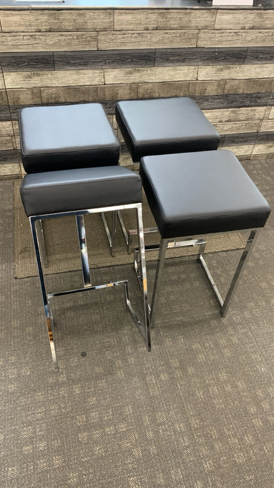 4 CHROME SQUARE STOOLS W/BLACK FAUX LEATHER SEAT.