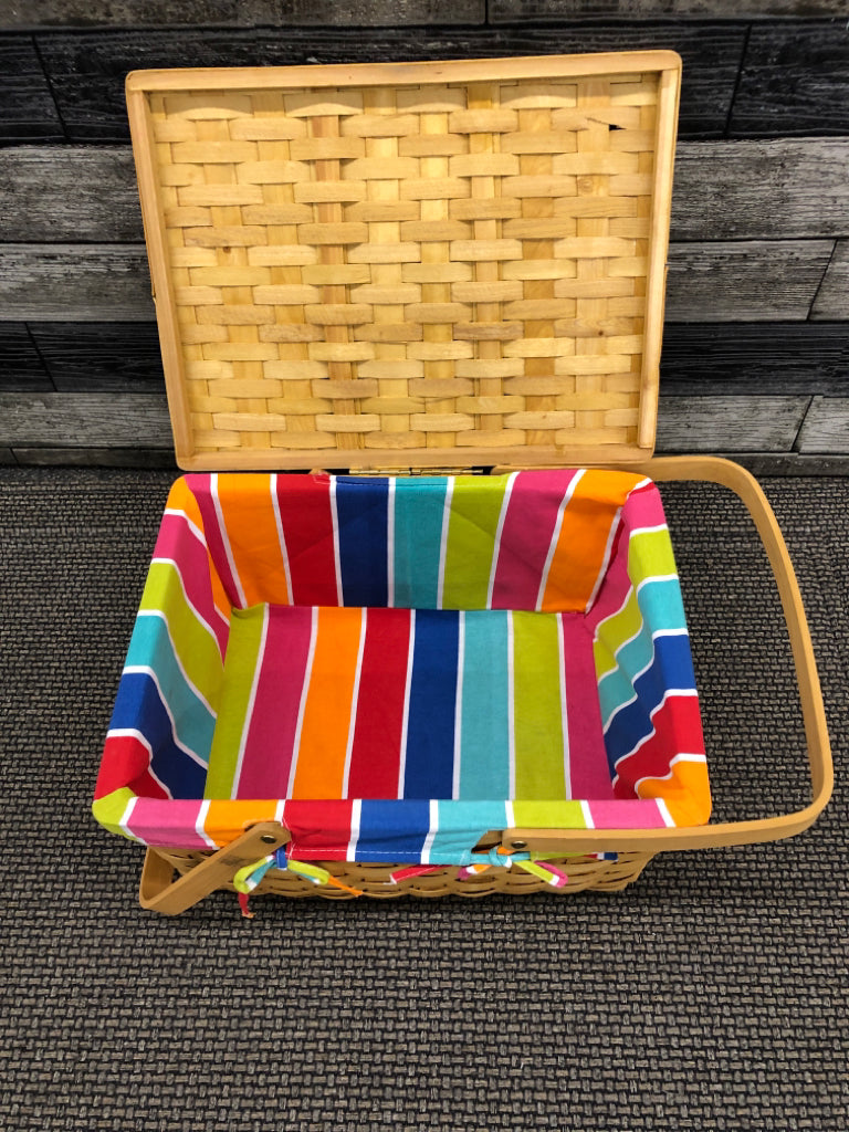 BLONDE WICKER BASKET WITH RAINBOW LINER WITH HANDLES.