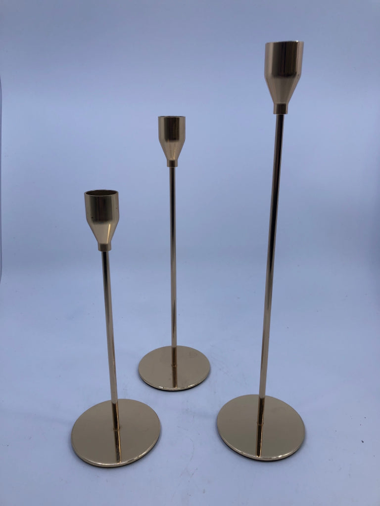 3 GOLD TAPER CANDLE HOLDER.