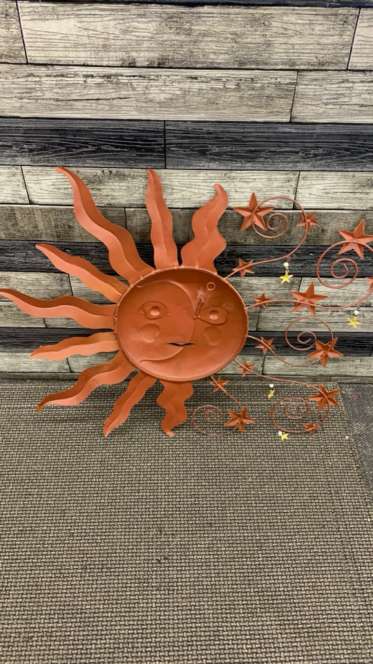 METAL SUN/MOON WALL HANGING.