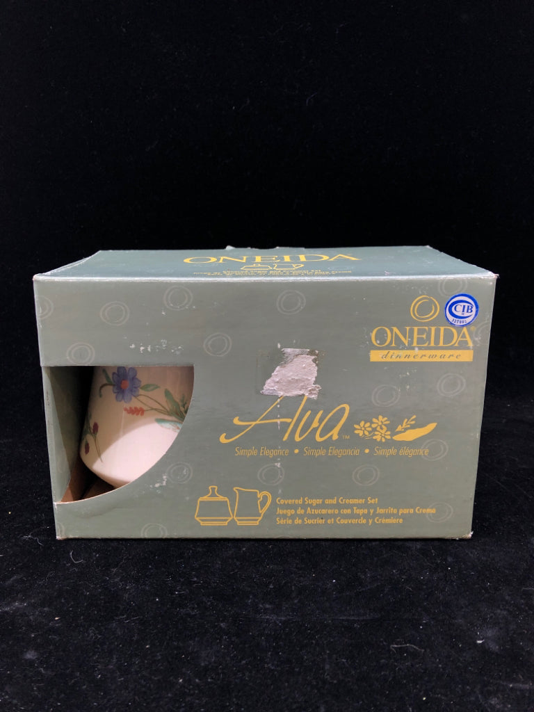 ONEIDA COVERED SUGAR AND CREAMER SET IN BOX.