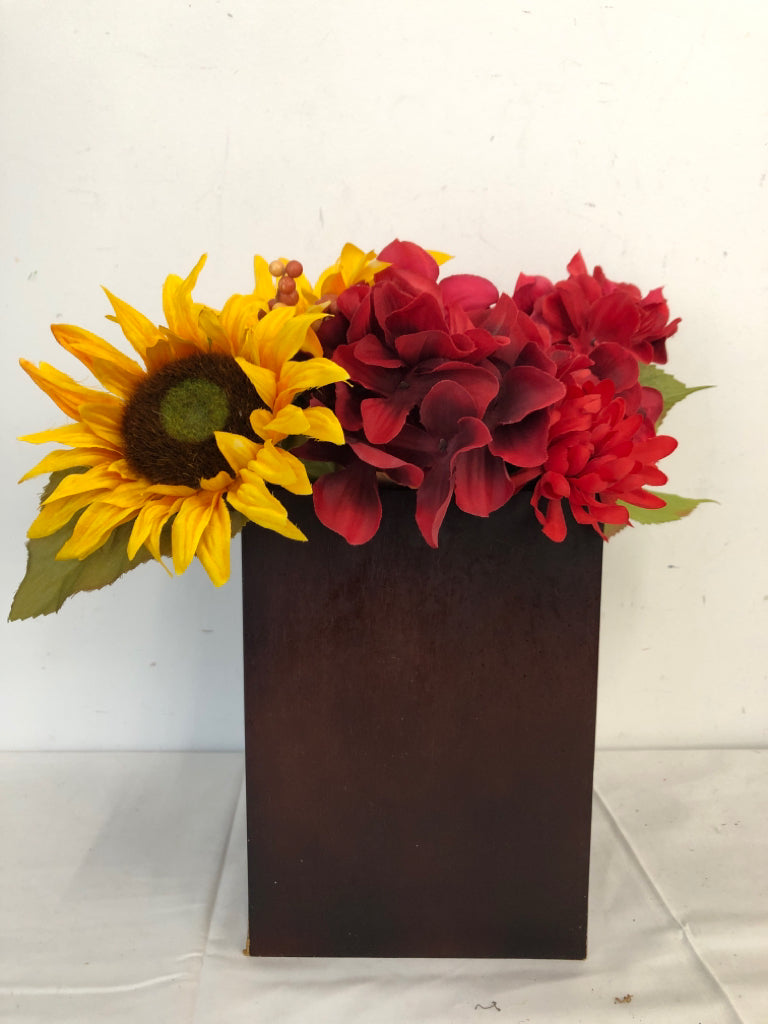 RED AND YELLOW FAUX FLORAL IN BROWN VASE.