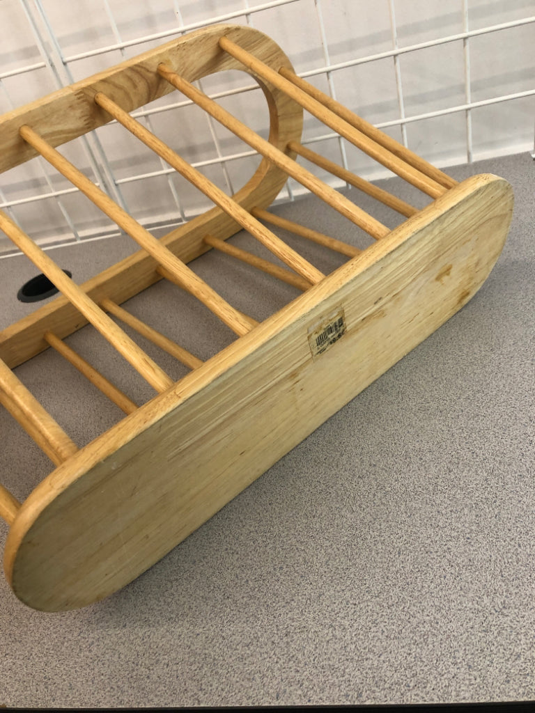 OVAL WOODEN MAGAZINE HOLDER.
