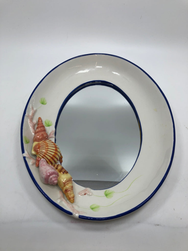 OVAL CERAMIC MIRROR W/SEASHELLS.