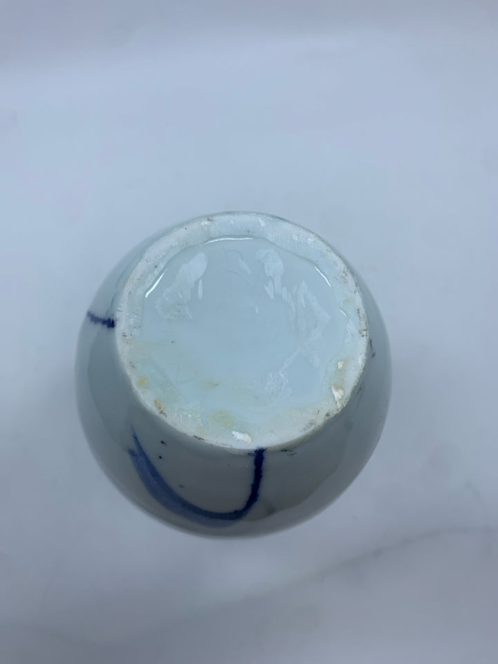 WHITE POTTERY VASE W/BLUE DESIGNS.