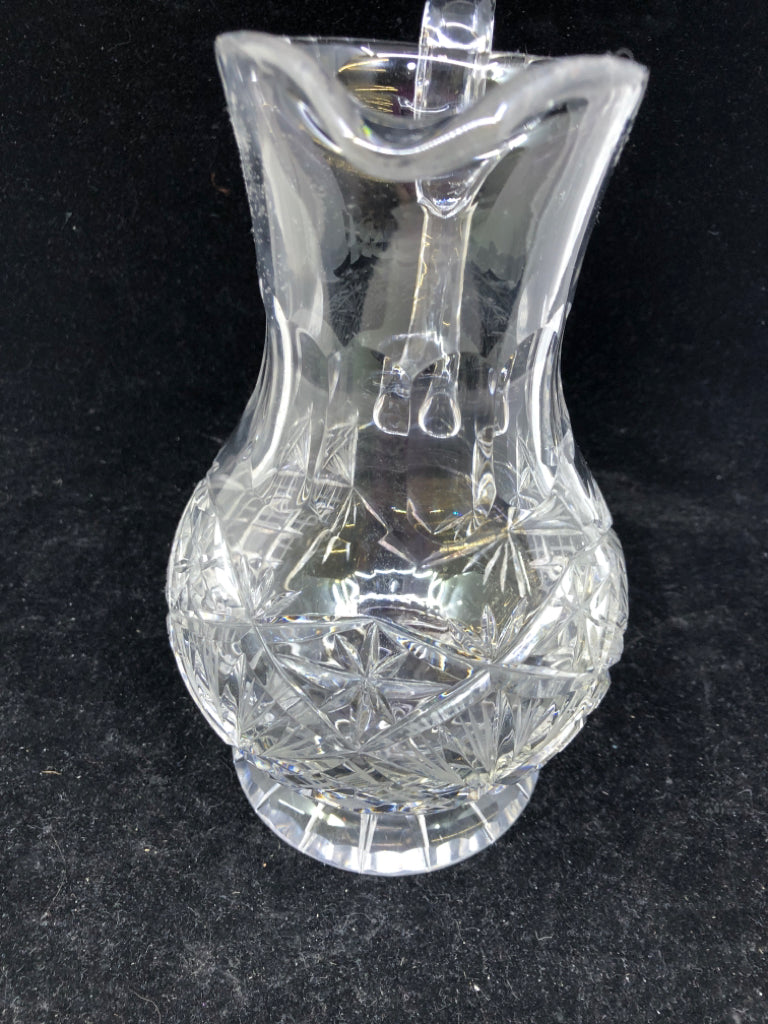 HEAVY CUT CRYSTAL FOOTED PITCHER.