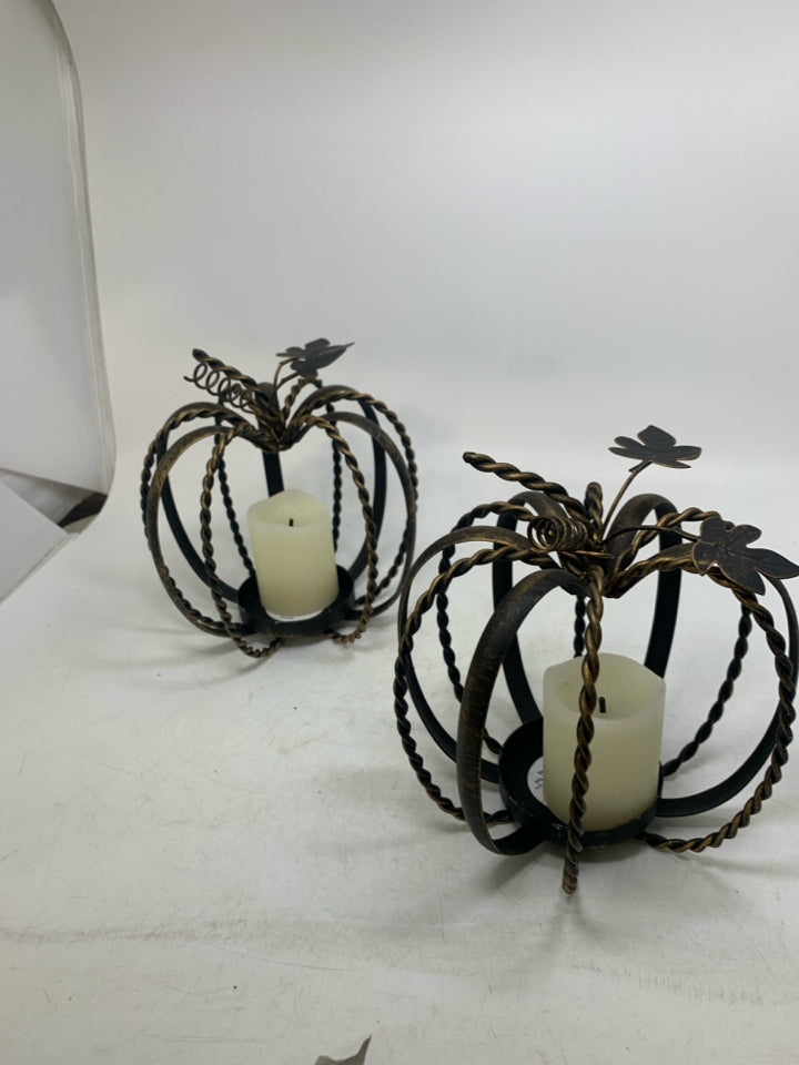 2 METAL PUMPKIN CAGE PILLAR CANDLE HOLDERS BRONZE W/ FAUX CANDLES.