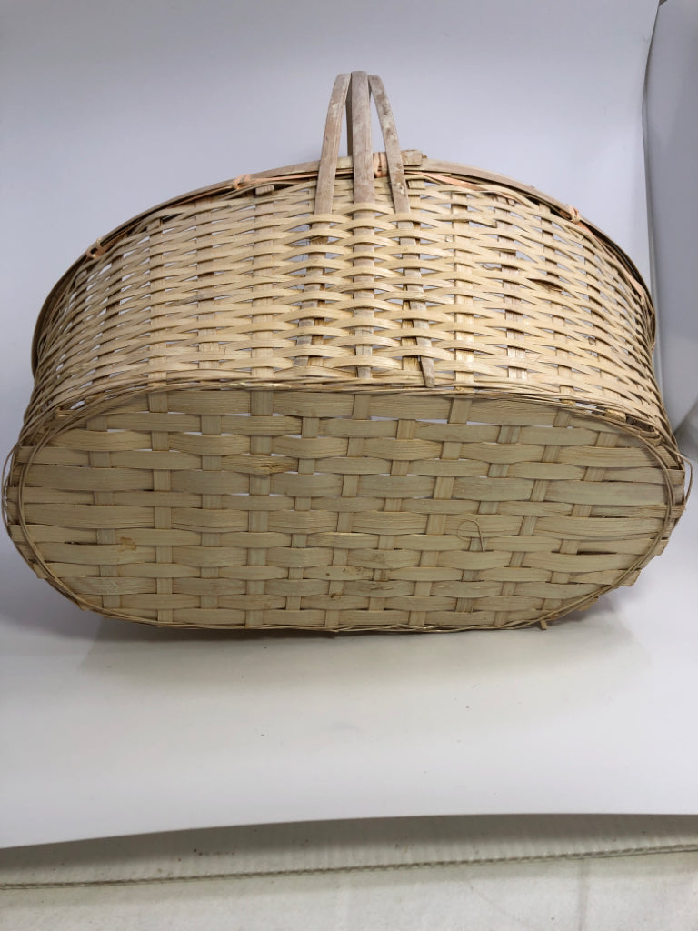 WHITE OVAL WOODEN BRAIDED BASKET W/WRAPPED HANDLE.