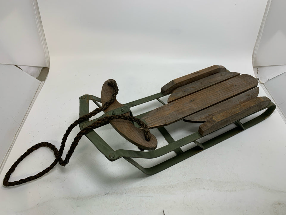 GREEN METAL BASE W/ WOOD SLATES SLED.