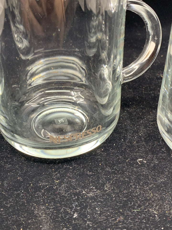 4 GLASS NESCAFE MUGS.