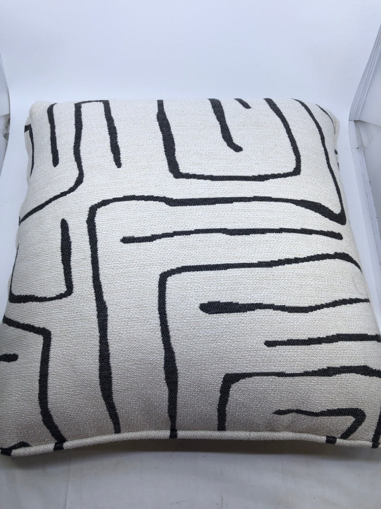WHITE ACCENT PILLOW WITH BLACK SWIRL.