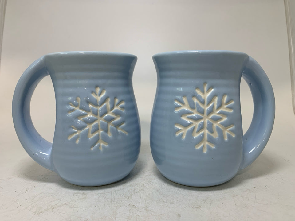 2 LIGHT BLUE MUGS W/ SNOWFLAKE IN CENTER.