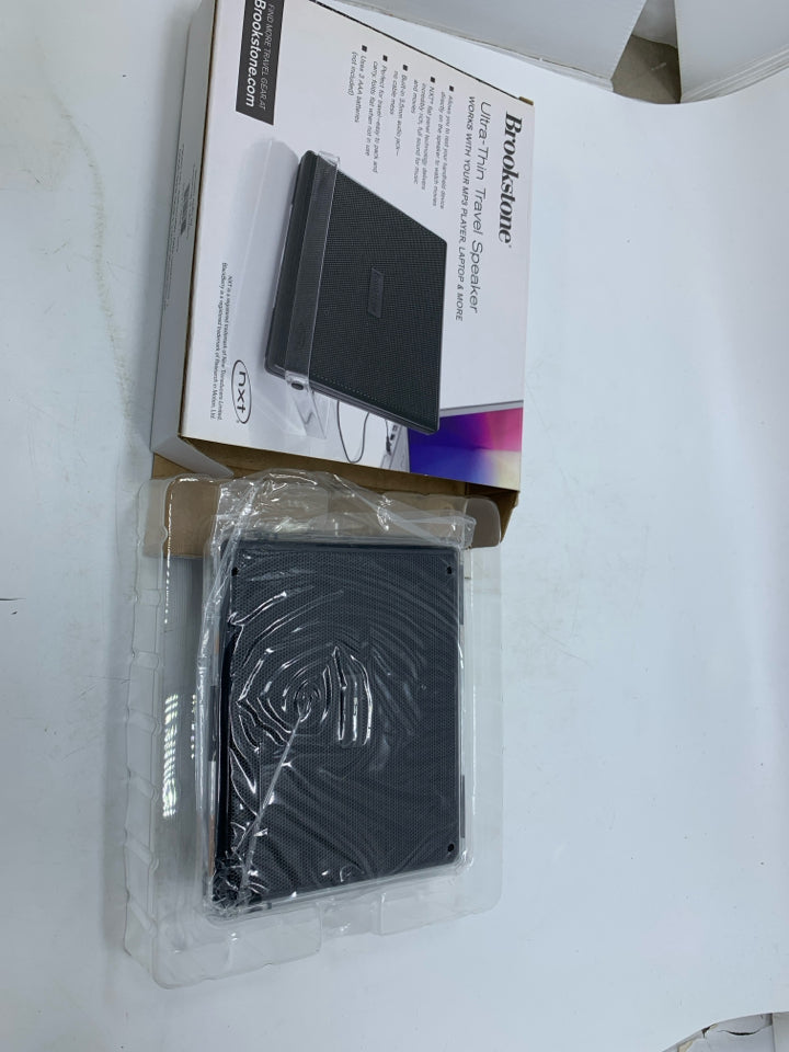NIB ULTRA-THIN TRAVEL SPEAKER.