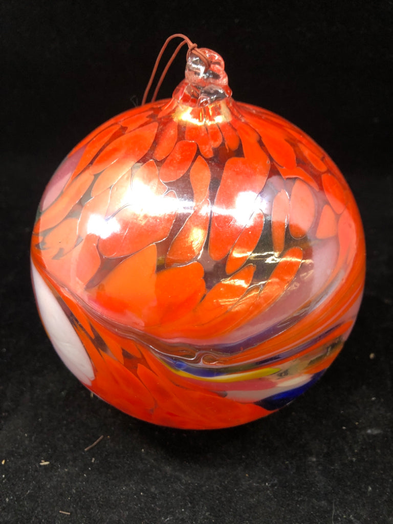 BLOWN GLASS ORANGE FLORAL DESIGN BALL.