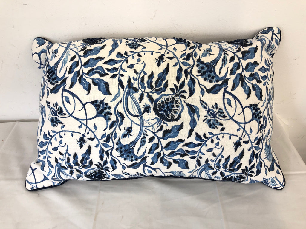 RECTANGLE PILLOW W/ BLUE FLORAL DESIGN- WHITE BACKGROUND EMBOSSED STITCHING.