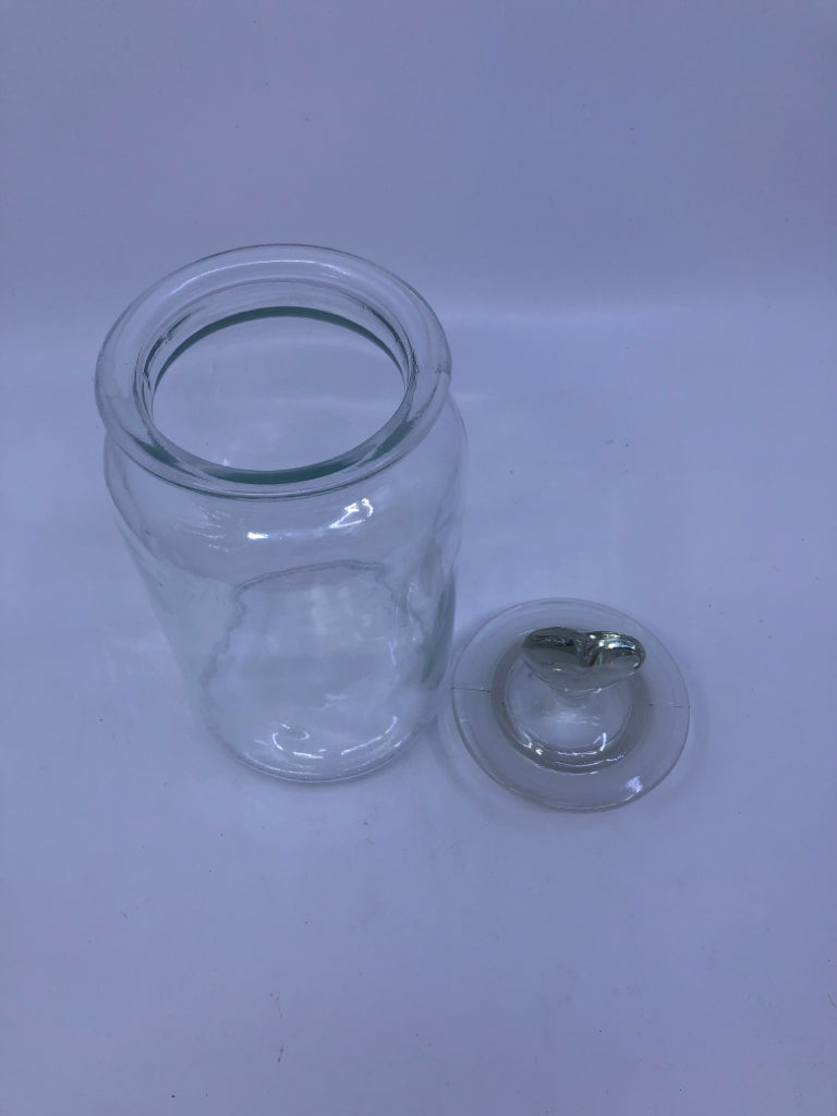 CLEAR GLASS CANISTER W/ HEART TOP HANDLE.