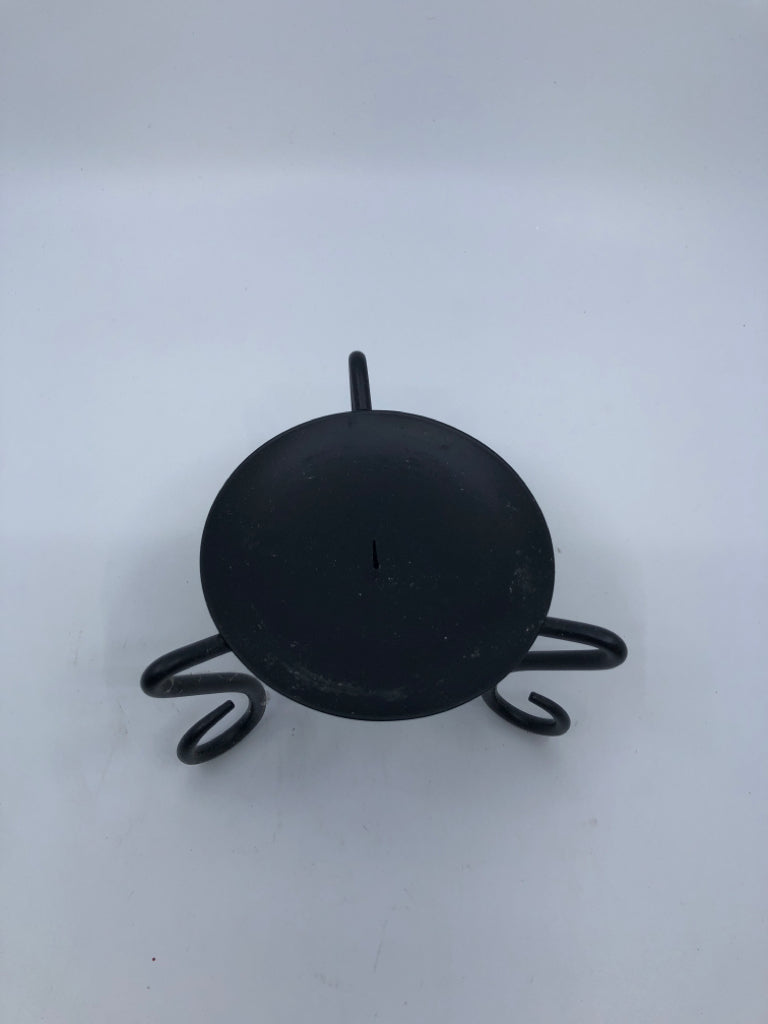 BLACK FOOTED CANDLE HOLDER.