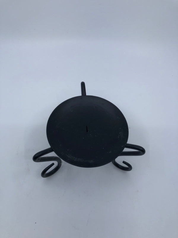 BLACK FOOTED CANDLE HOLDER.