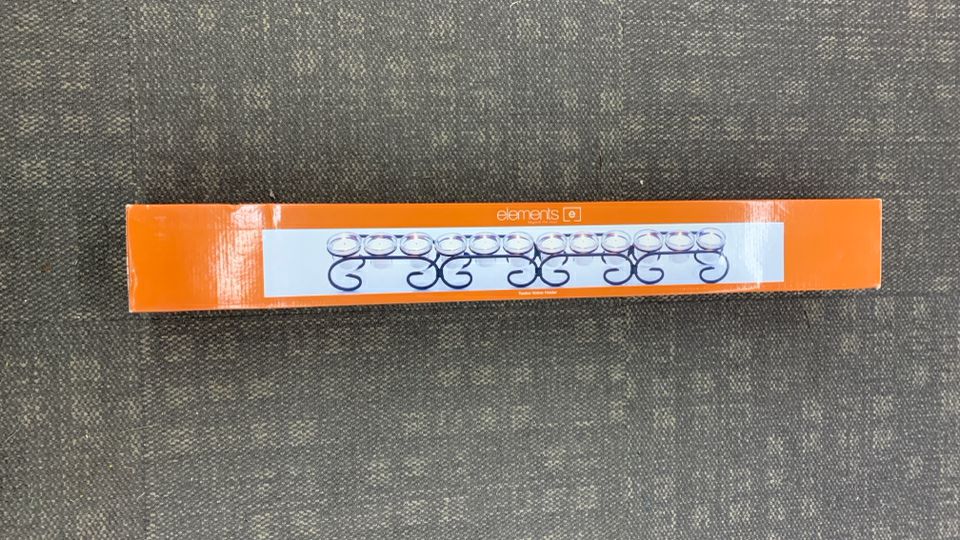 NIB 12 SPOT VOTIVE HOLDER.