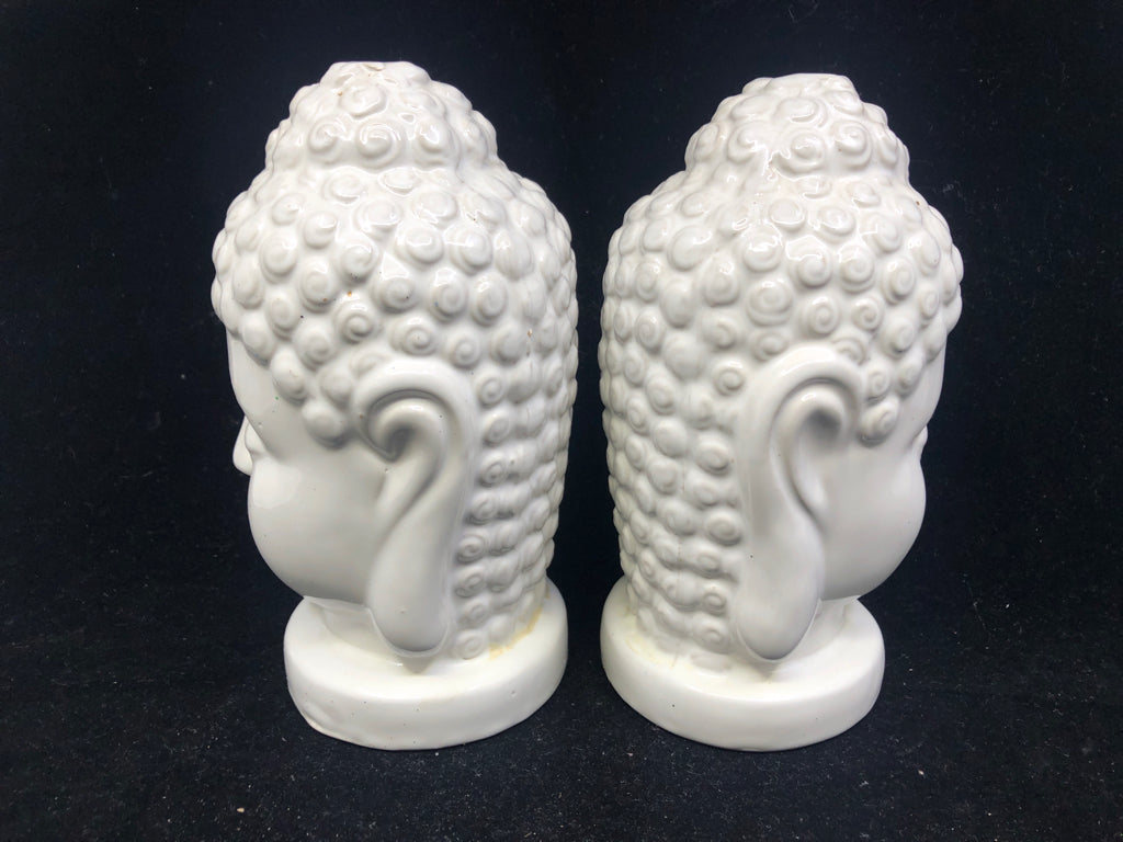 2 WHITE CERAMIC BUDDHA HEADS.