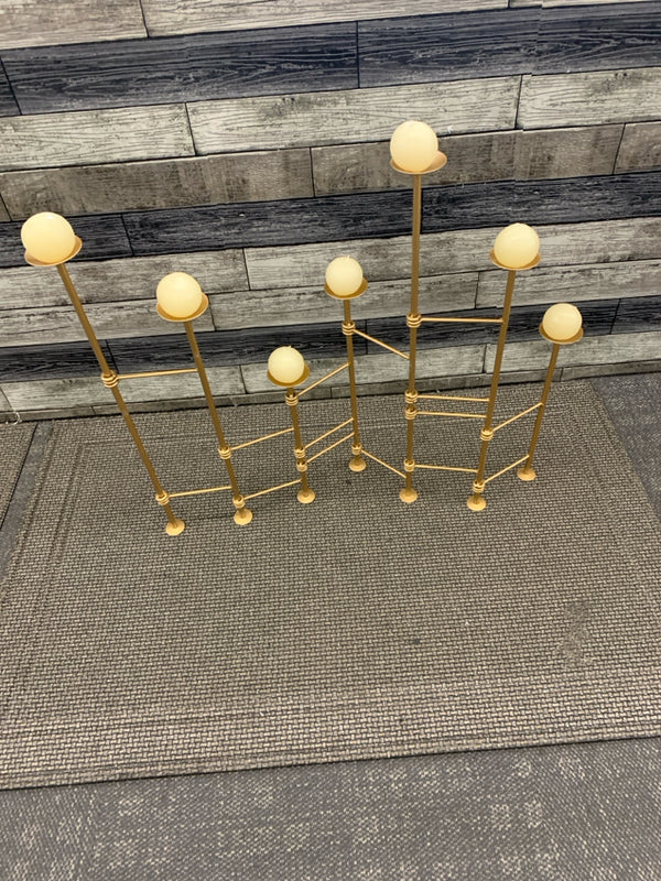 GOLD ADJUSTABLE FIRE PLACE CANDLE HOLDER.