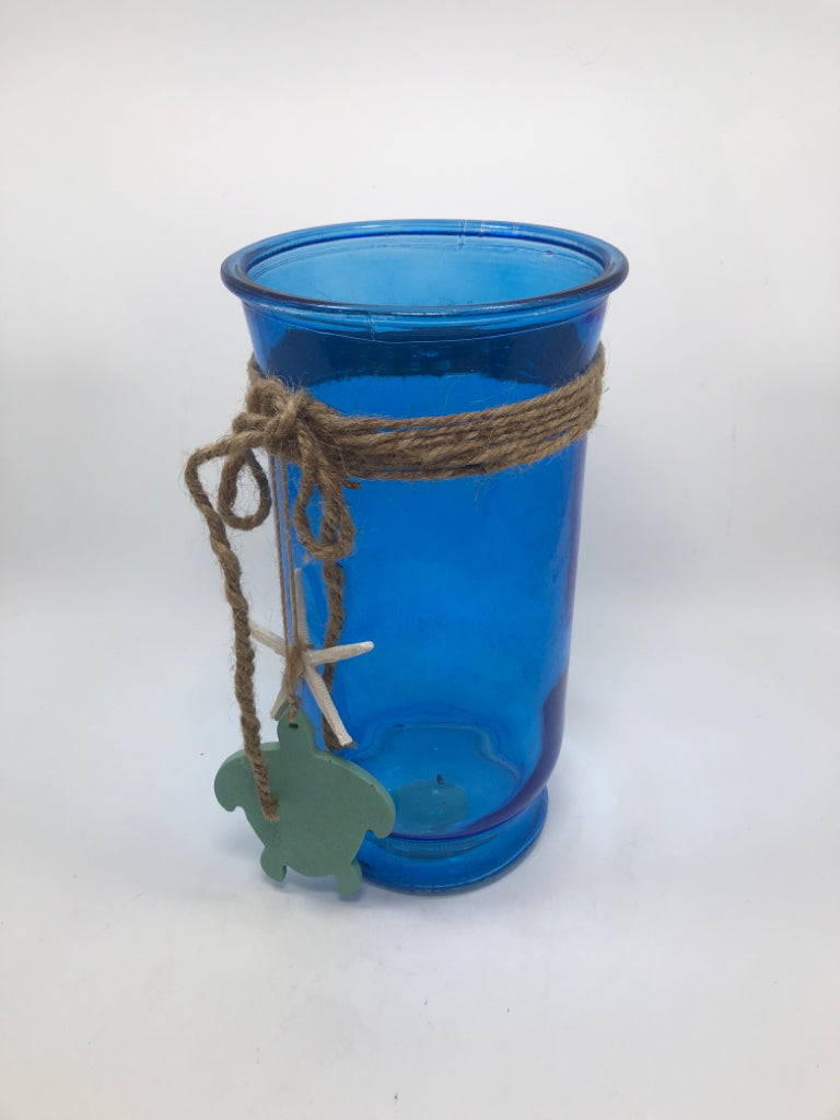 BLUE GLASS CANDLE VASE W/BURLAP AND TURTLE.