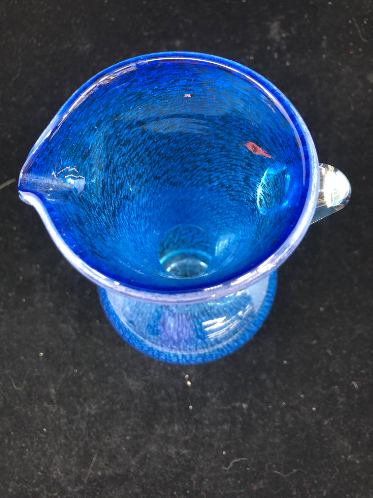 BLUE BLOWN GLASS PITCHER W/ CLEAR GLASS HANDLE.