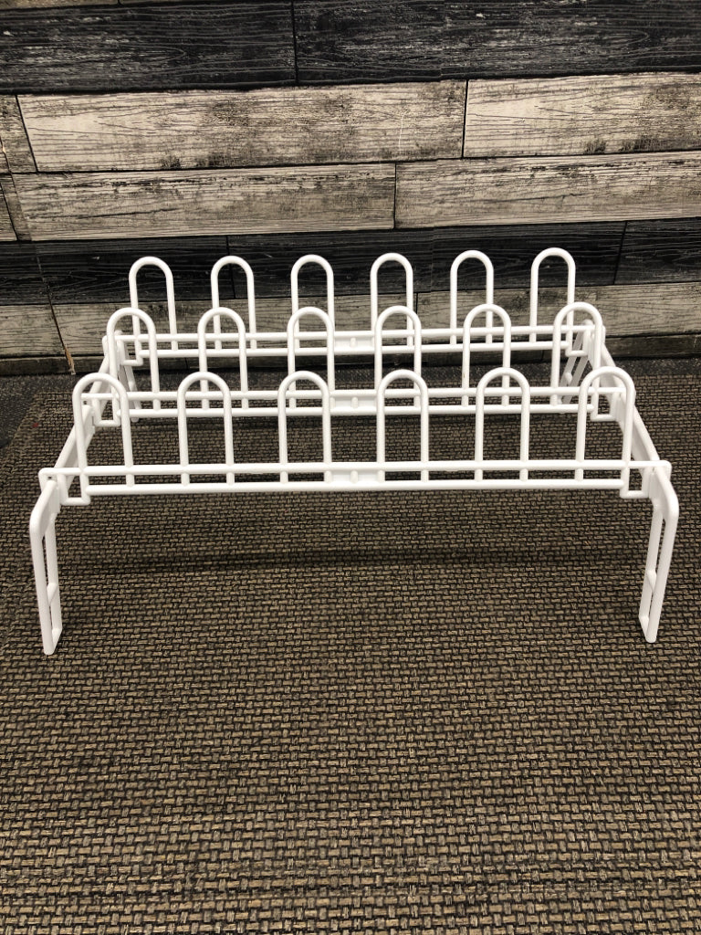 WHITE PLASTIC STANDING SHOE RACK.