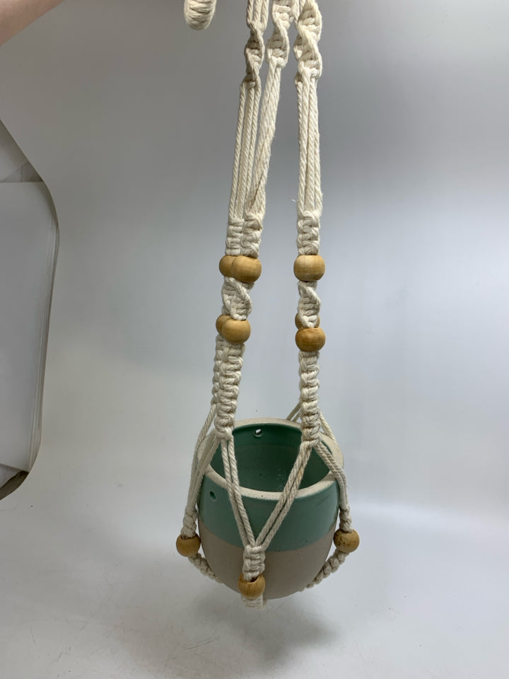 TWO TONED TEAL/GRAY PLANTER IN MACRAME PLANT HANGER.