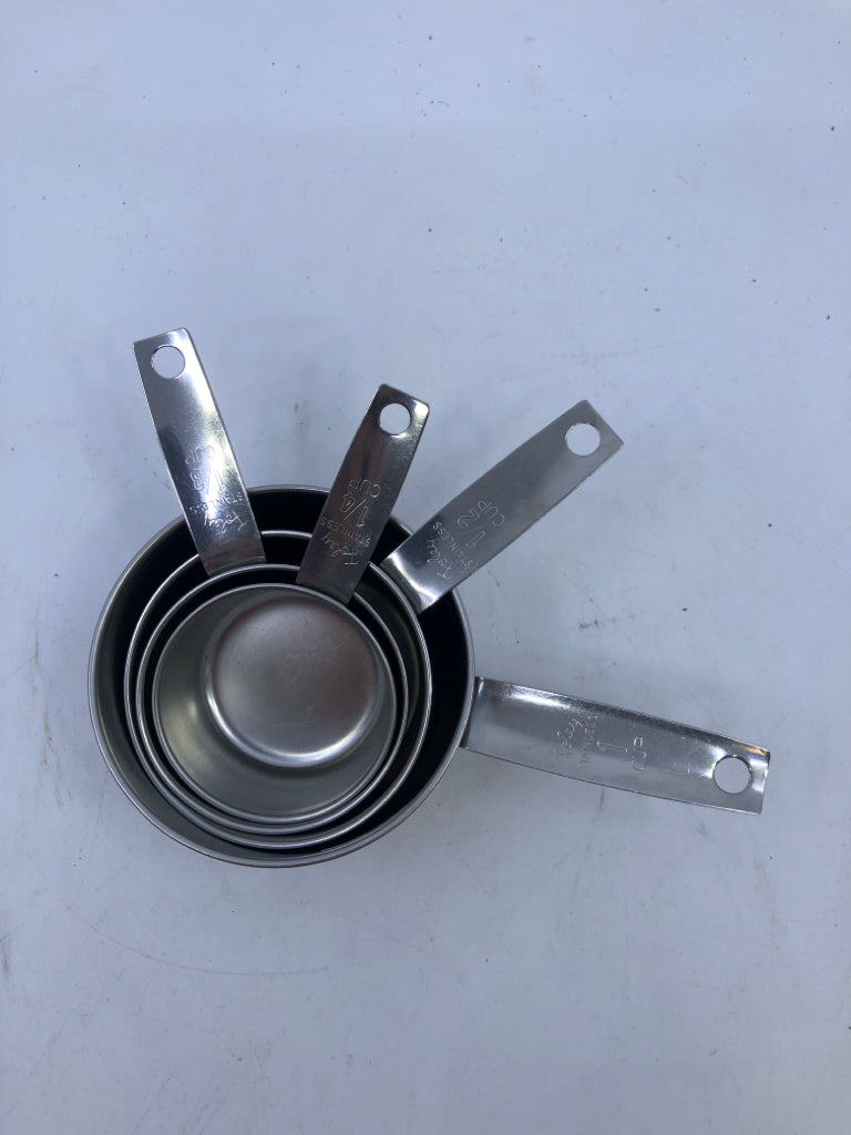 4 STACKING SILVER MEASURING CUPS.