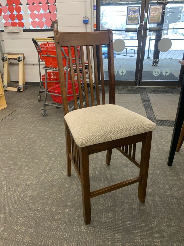 WOOD HIGH TOP TABLE W/ BLACK LEGS 4 UPHOLSTERED.