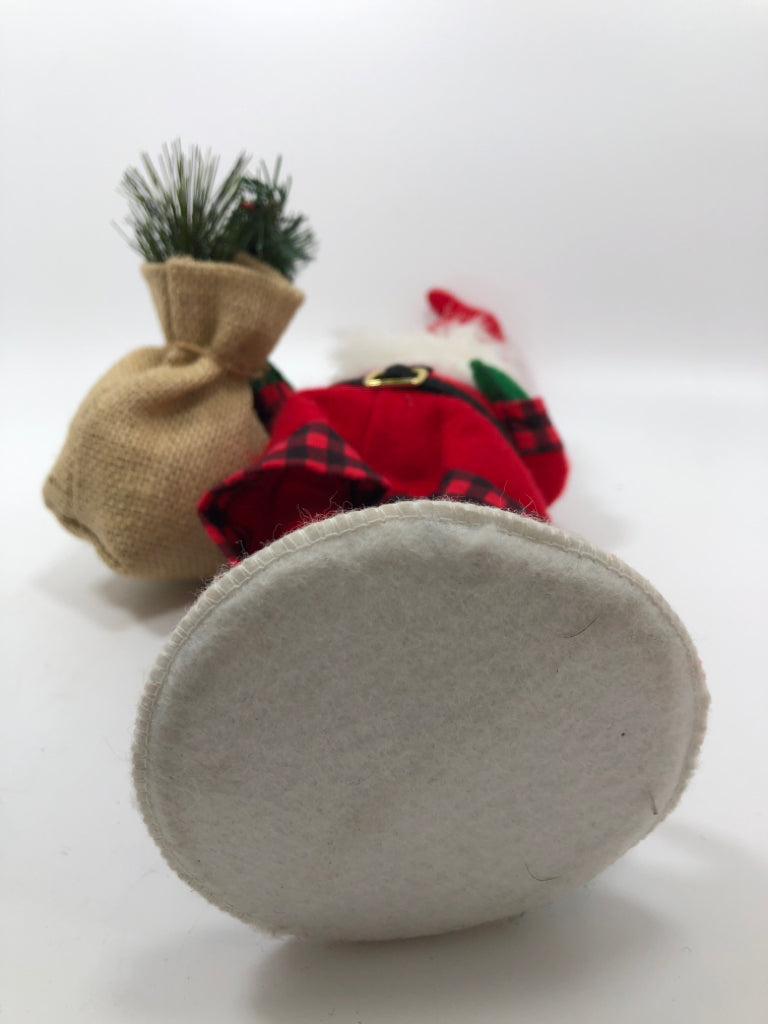 ANNALEE MINI SANTA IN ELF SHOES HOLDING CHRISTMAS SACK.