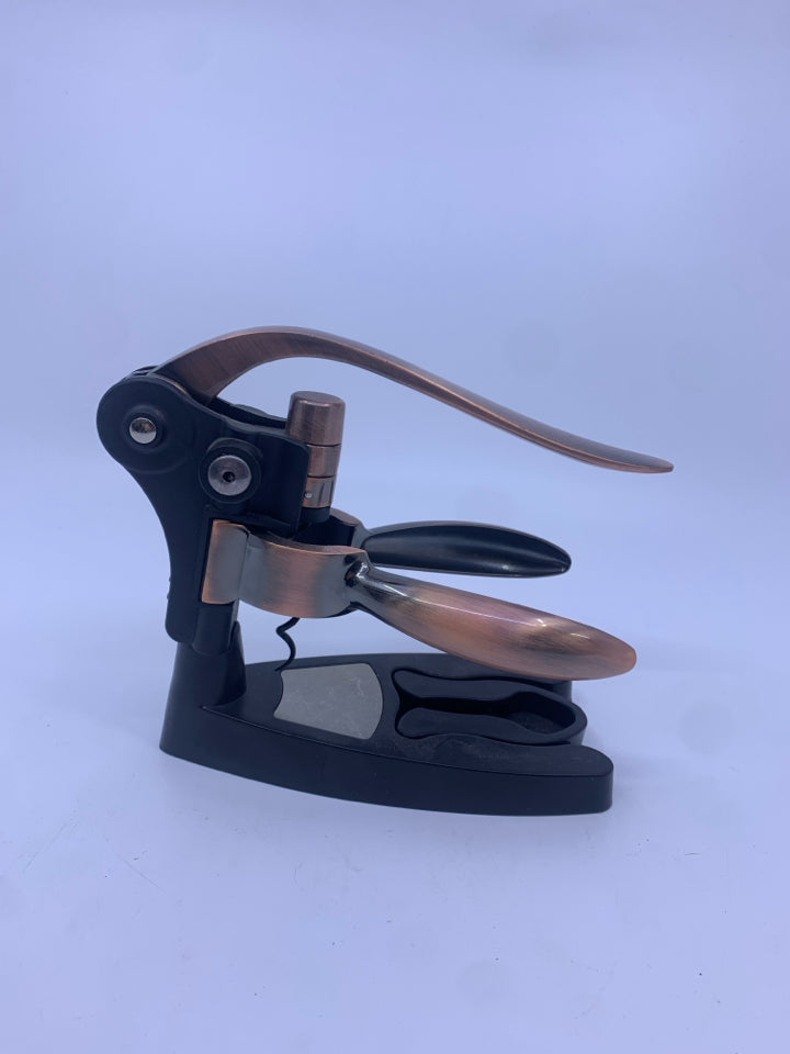 ROSE GOLD WINE OPENER W STAND.