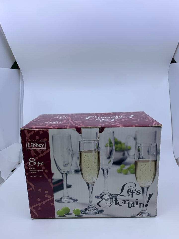 NIB LIBBEY 8 CHAMPAGNE FLUTES.